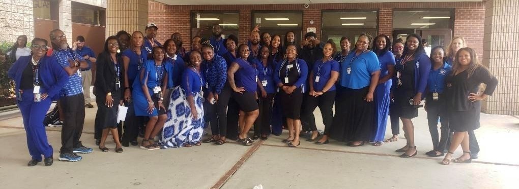 Faculty and Staff after the first day of school wearing blue and black to show their Jaguar Pride!